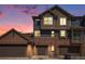Charming townhome exterior with a brick and siding facade, complemented by a three-car garage at 755 Roslyn St # 17, Denver, CO 80230