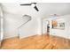 Open living room featuring hardwood floors, stairway and an open view of the kitchen area at 755 Roslyn St # 17, Denver, CO 80230