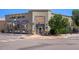 Facade of retail space in a pedestrian-friendly zone features storefront windows, signage, and ample street parking at 755 Roslyn St # 17, Denver, CO 80230