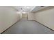 A large finished basement features neutral carpeting and track lighting at 451 Wright St # 11, Lakewood, CO 80228