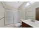 This is a bathroom that features a shower with sliding glass doors, a sink, and a toilet at 451 Wright St # 11, Lakewood, CO 80228