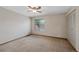 A spacious bedroom features neutral carpet, a window for natural light, and a ceiling fan at 451 Wright St # 11, Lakewood, CO 80228