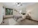 Serene bedroom with a queen-sized bed, neutral decor, and a large window offering natural light at 451 Wright St # 11, Lakewood, CO 80228