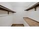 A walk-in closet offers ample storage space with shelves and hanging rods at 451 Wright St # 11, Lakewood, CO 80228