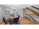 The dining room area features modern decor and easy access to the staircase and kitchen at 451 Wright St # 11, Lakewood, CO 80228