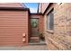 Charming front entrance with a brown door, complemented by a wreath and welcoming mat at 451 Wright St # 11, Lakewood, CO 80228