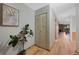 Hallway features beautiful wood floors, closet, and decorative touches with ample space and natural light at 451 Wright St # 11, Lakewood, CO 80228