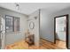 Bright hallway area with a functional rolling beverage cart that leads to a bathroom and other rooms at 451 Wright St # 11, Lakewood, CO 80228