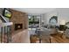 Bright and airy living area with a stone fireplace, comfortable seating, and access to a balcony at 451 Wright St # 11, Lakewood, CO 80228
