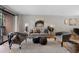Comfortable living room featuring a sofa, arm chairs, decorative pillows, and a sliding glass door at 451 Wright St # 11, Lakewood, CO 80228