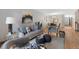 Cozy living room with comfortable seating, stylish decor, and an open layout leading to the dining area at 451 Wright St # 11, Lakewood, CO 80228