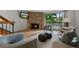 Inviting living room featuring a stone fireplace, modern decor, and natural light from a sliding glass door at 451 Wright St # 11, Lakewood, CO 80228