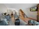 Comfortable living room with a staircase, featuring a TV, sofa, accent chairs and a view into the kitchen at 451 Wright St # 11, Lakewood, CO 80228