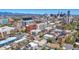 Bustling Denver neighborhood aerial view featuring a mix of buildings, businesses, and cityscape with clear, bright skies at 590 N Logan St # 303, Denver, CO 80203