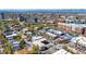 Wide aerial view showcasing the buildings and streets of Denver with a stunning backdrop of mountains and blue skies at 590 N Logan St # 303, Denver, CO 80203