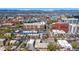 Scenic aerial view of Denver neighborhood featuring buildings, streets, and a backdrop of snow-capped mountains under a clear blue sky at 590 N Logan St # 303, Denver, CO 80203