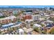 Detailed aerial shot capturing Denver's urban landscape, showcasing residential buildings, businesses, and clear blue skies at 590 N Logan St # 303, Denver, CO 80203