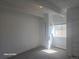 Neutral bedroom with soft carpeting, closet storage, and a bright sunny window at 590 N Logan St # 303, Denver, CO 80203