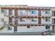 Apartment building exterior with stairways to the upper units and light-colored brick at 590 N Logan St # 303, Denver, CO 80203