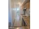 Functional kitchen featuring tiled floors, ample cabinet space, and essential appliances at 590 N Logan St # 303, Denver, CO 80203