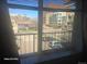 View from a window of a street scene with cars and buildings at 590 N Logan St # 303, Denver, CO 80203