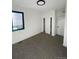 Bright bedroom with large window, closet, and carpeting at 1250 Yates St, Denver, CO 80204