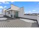 Wide rooftop deck with snow and sleek modern design at 1250 Yates St, Denver, CO 80204