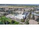 Aerial shot showcases building with pool, surrounded by greenspace and community residences at 9320 E Center Ave # 7A, Denver, CO 80247