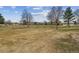 Vast grassy grounds and mature trees in front of apartment buildings at 9320 E Center Ave # 7A, Denver, CO 80247