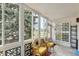 Cozy sunroom with large windows, decorative walls, and comfortable seating at 9320 E Center Ave # 7A, Denver, CO 80247