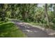 A paved walking path bordered by trees, offering a scenic route for exercise and leisurely strolls at 9320 E Center Ave # 7A, Denver, CO 80247