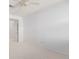 Bright bedroom featuring neutral carpet, white walls, and ample natural light at 15455 Canyon Rim Dr # 304, Englewood, CO 80112