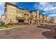 Attractive condominium building with stone accents, manicured landscaping, and a vibrant, colorful exterior at 15455 Canyon Rim Dr # 304, Englewood, CO 80112