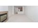 Expansive living room featuring a fireplace, neutral carpet, and a seamless connection to the kitchen at 15455 Canyon Rim Dr # 304, Englewood, CO 80112