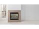 Living room with tile trimmed fireplace and door to outdoor deck at 15455 Canyon Rim Dr # 304, Englewood, CO 80112