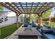Enjoy outdoor living with a covered pergola and stylish patio furniture, perfect for entertaining guests at 2420 S Gilpin St, Denver, CO 80210