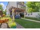 A peaceful backyard setting showcasing a pergola, lush lawn, and stylish landscaping for outdoor enjoyment at 2420 S Gilpin St, Denver, CO 80210