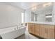 Luxurious bathroom featuring a standalone tub, double vanity sinks, and sleek modern design at 2420 S Gilpin St, Denver, CO 80210