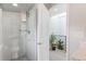 Well-lit bathroom featuring a shower with glass doors, complemented by neutral tones at 2420 S Gilpin St, Denver, CO 80210