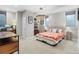 Bright bedroom with carpet, featuring a large window, decorative lighting, and a workstation at 2420 S Gilpin St, Denver, CO 80210