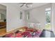 Bright bedroom with natural light, hardwood floors, and a functional workspace, offering a comfortable environment at 2420 S Gilpin St, Denver, CO 80210