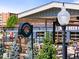 Outdoor patio area for Denver Beer Co featuring picnic tables and fresh landscaping at 2420 S Gilpin St, Denver, CO 80210
