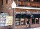 Charming brick building exterior with a wine shop and liquor store, featuring outdoor signage at 2420 S Gilpin St, Denver, CO 80210