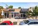 Commercial building featuring several businesses, including a sandwich shop and a barber shop at 2420 S Gilpin St, Denver, CO 80210