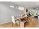 This dining area includes a rustic table and decorative lighting, providing an inviting gathering space at 2420 S Gilpin St, Denver, CO 80210