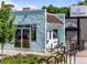 Charming ice cream shop exterior with a light blue facade and inviting outdoor seating at 2420 S Gilpin St, Denver, CO 80210