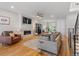 Bright living room boasts hardwood floors, a modern fireplace, and comfortable seating perfect for relaxing at 2420 S Gilpin St, Denver, CO 80210