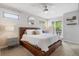 Stylish main bedroom with modern fixtures, ensuite bath access, and a balcony at 2420 S Gilpin St, Denver, CO 80210