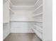 Well-organized walk-in closet with built-in shelving, and ample storage space at 2420 S Gilpin St, Denver, CO 80210