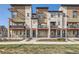 Modern townhome exterior featuring private balconies, stylish architecture, and well-maintained landscaping at 9023 E Northfield Blvd, Denver, CO 80238